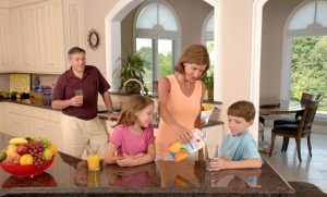 family-drinking-orange-juice-619144-300x181.jpg